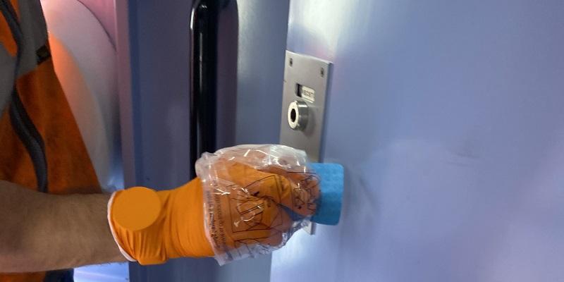 A swab being taken from a train toilet door. Picture credit: Public Health England